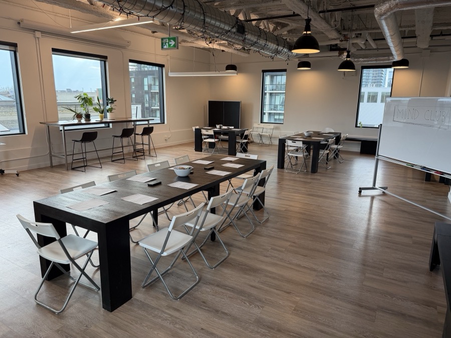 Mind Club venue — tables and chairs set up ready for a session